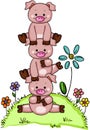 Stack of three little piggies in garden with flowers