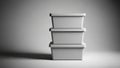 Stack of three minimalist plastic storage boxes in black and white lighting Royalty Free Stock Photo