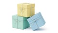 A stack of three pastel-colored gift boxes with bows on a clean white background Royalty Free Stock Photo