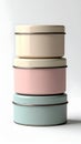 Stack of Three Pastel Colored Metal Tins on a White Background with Shadows Royalty Free Stock Photo