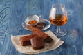 Stack of three pieces of chocolate brownie cake on a wooden back Royalty Free Stock Photo