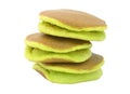 A stack of three plain pancakes on a white background.