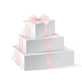 Stack of three realistic white gift boxes