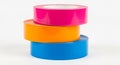 Stack of three rolls of brightly colored duct tape on a white background pile Royalty Free Stock Photo