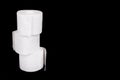 Stack of three rolls of toilet paper isolated on black background Royalty Free Stock Photo