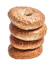 A stack of three sesame-seeded bagels isolated on a white background displays a tempting bakery item
