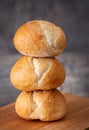 Stack of three small loaves of sourdough bread Royalty Free Stock Photo