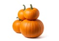 A stack of three small orange pumpkins on a white background Royalty Free Stock Photo