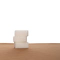 Stack of three sugar cubes on fabric, white background. Healthy eating. Royalty Free Stock Photo