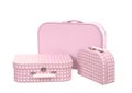 Stack of three suitcases, pink with white dots