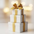 Stack of Three White Gift Boxes Tied with Gold Ribbon and Bow image photo Royalty Free Stock Photo