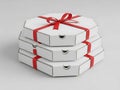 Stack of three white pizza boxes with red ribbons Royalty Free Stock Photo