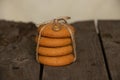 A stack of tied cookies with a rope lies on an wooden table Royalty Free Stock Photo