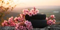 Stack of tires against the backdrop of a beautiful spring landscape with flowers blooming on the trees at dawn , concept