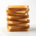 Stack of toasted white bread slices arranged neatly on a light surface Royalty Free Stock Photo