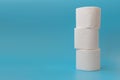 Stack of toilet paper rolls on blue background. Copy space Royalty Free Stock Photo