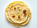 A stack of tortillas sitting on top of a white surface Royalty Free Stock Photo
