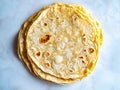 A stack of tortillas sitting on top of a white table Royalty Free Stock Photo