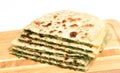 Stack tortillas stuffed with herbs. Royalty Free Stock Photo