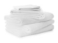 Stack of towels and bed sheets on white background