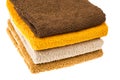 Stack of towels of different colors on white background