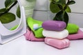 A stack of towels soap toothbrush mirror and houseplant on the bathroom table Royalty Free Stock Photo