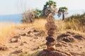 Stack tower stone zen art folded blurred rock background. large small ascending stone cobblestone tower. Royalty Free Stock Photo