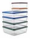 Stack of Transparent Plastic Containers with Multicolored Lids on White Background Royalty Free Stock Photo