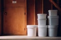 Stack of Unlabeled Containers Organized in a Garage With Clear Space on the Left Side for Additional Items or Movement Royalty Free Stock Photo