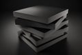 stack of unopened pizza boxes black on a black background Royalty Free Stock Photo