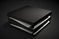 stack of unopened pizza boxes black on a black background Royalty Free Stock Photo