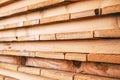 Stack of untreated wooden planks timber boards as construction material