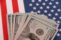 Stack of US dollar banknotes on the United States flag Royalty Free Stock Photo