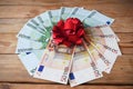 Stack of usa dollars and bow, Money gift, pile of cash with red bow Royalty Free Stock Photo