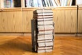 Stack of used books tied with packthread on floor