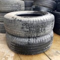 Stack of used tires on floor Royalty Free Stock Photo