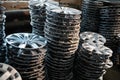 stack of various alloy wheels in tire store