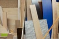 Stack of various construction supplies samples. Insulation foams and wood boards Royalty Free Stock Photo