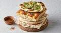 Dark rye bread at the bottom followed by thin flatbreads a thicker Royalty Free Stock Photo