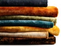 A stack of various velvet fabrics in rich colors Royalty Free Stock Photo
