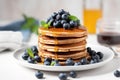 stack of vegan pancakes with maple syrup and blueberries Royalty Free Stock Photo