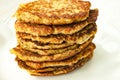 Stack of vegetable Zucchini fritters served on white plate close up Royalty Free Stock Photo