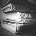 Stack of worn antique books. Black and White. Royalty Free Stock Photo