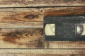 Stack of VHS video tape cassette over wooden background. top view photo Royalty Free Stock Photo