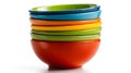 Stack of vibrant, colorful ceramic bowls on a plain white background Royalty Free Stock Photo