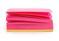 Bright pink sticky notes stacked neatly with yellow base isolated on white background Royalty Free Stock Photo
