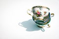 Stack of vintage porcelain tea cups on white background Royalty Free Stock Photo