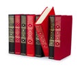 Stack of vintage red and black books with gold ornament Royalty Free Stock Photo