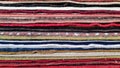 Closeup of folded rugs texture. Striped pattern background