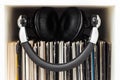 Stack of vinyl records with headphones on top Royalty Free Stock Photo